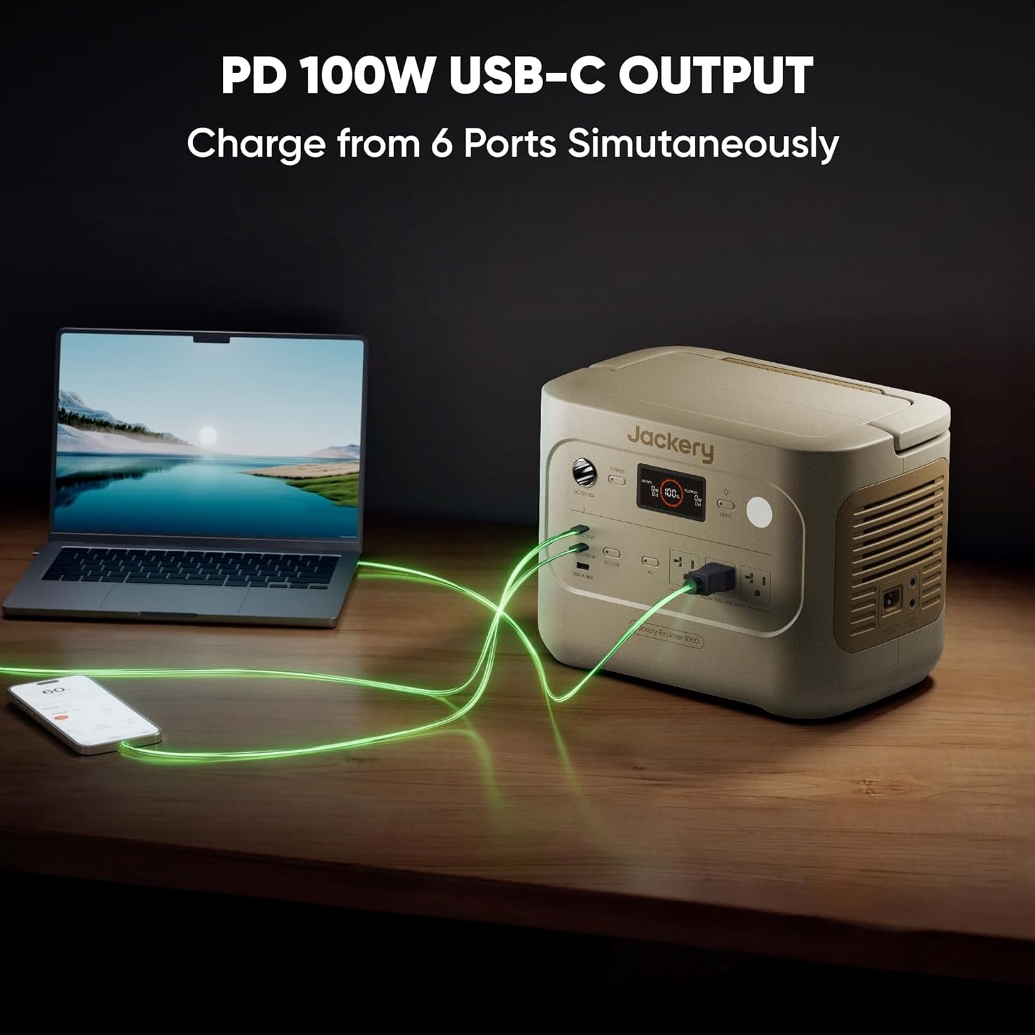 Jackery Explorer 1000 portable power station with PD 100W USB-C charging laptop and smartphone simultaneously